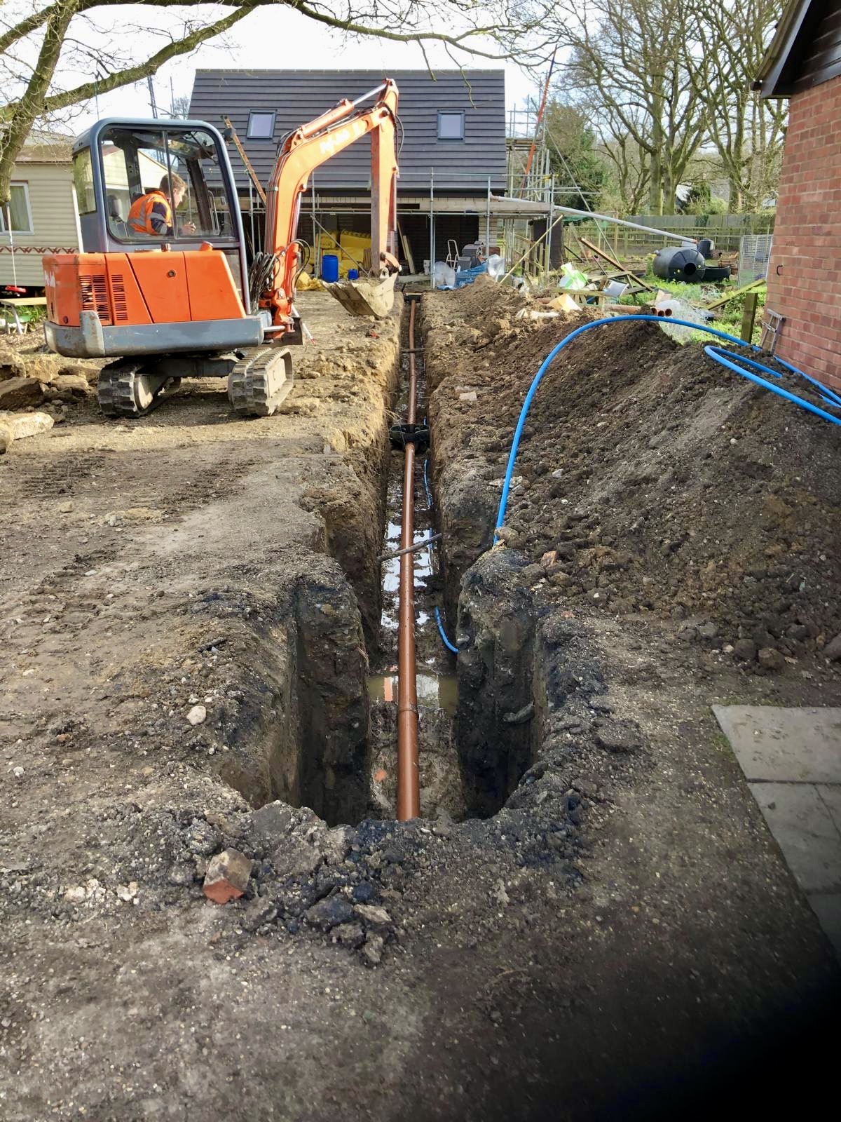 Drainage run dug to fall alongside the property