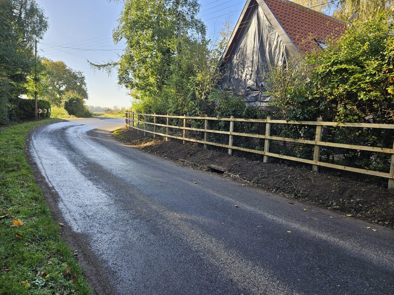 Fence line following the road