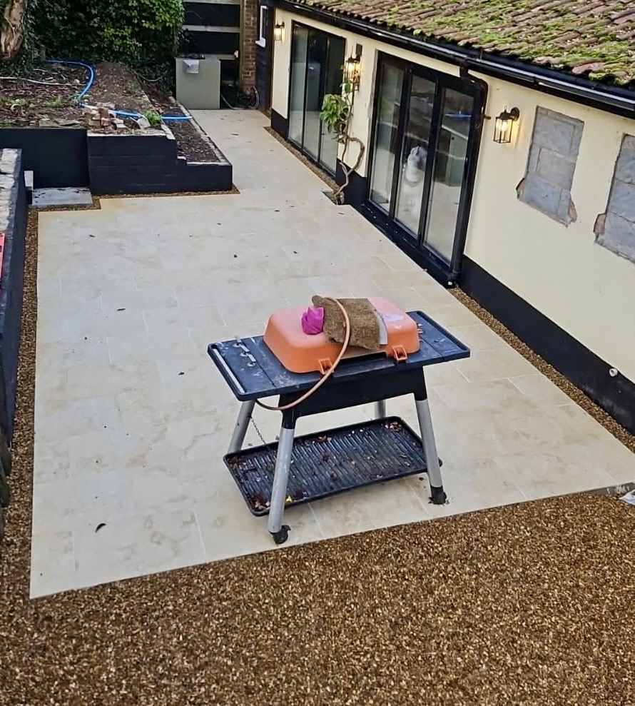 Cream stone patio with resin-bond surround