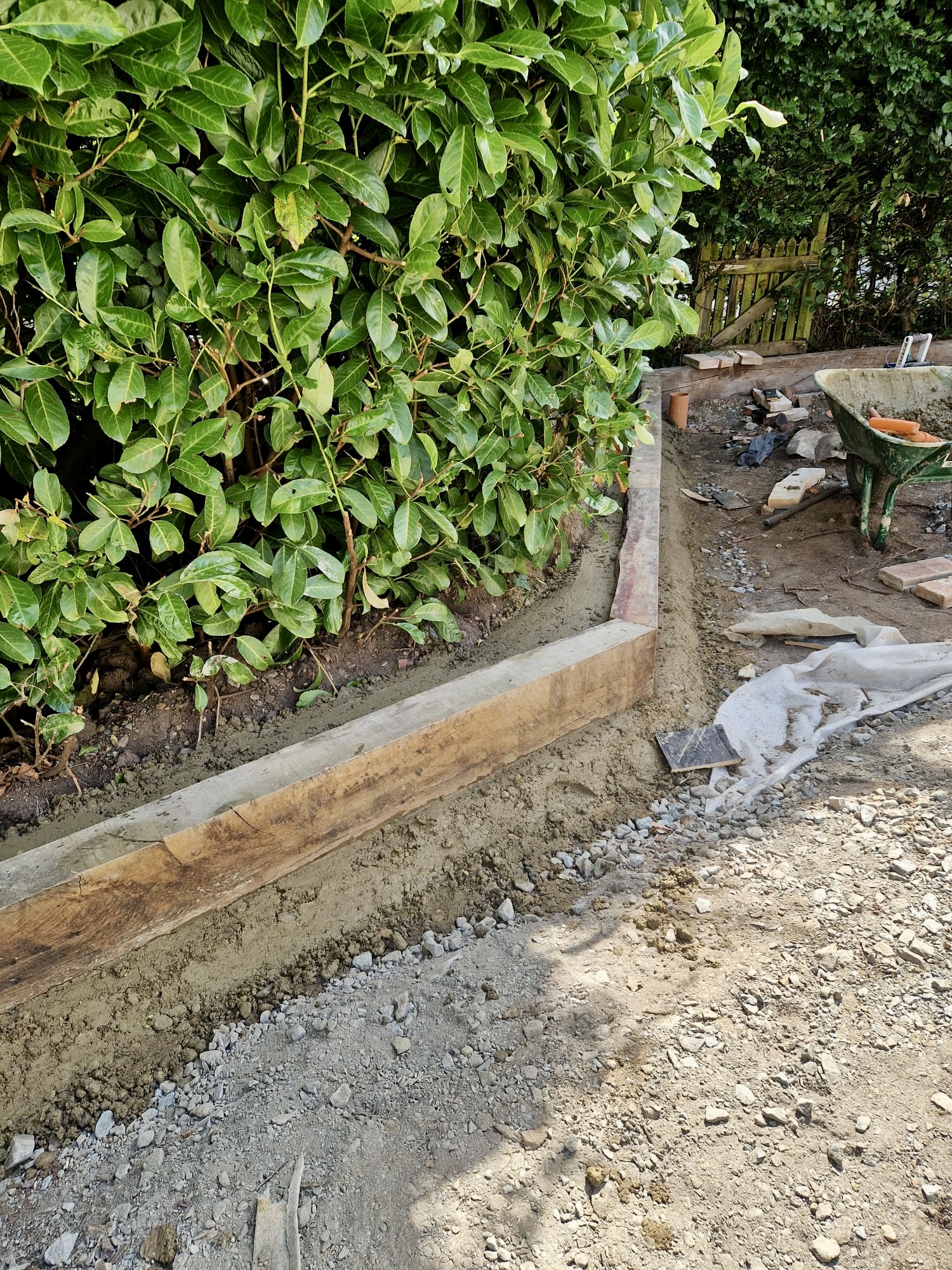 Sleeper edging along a hedge